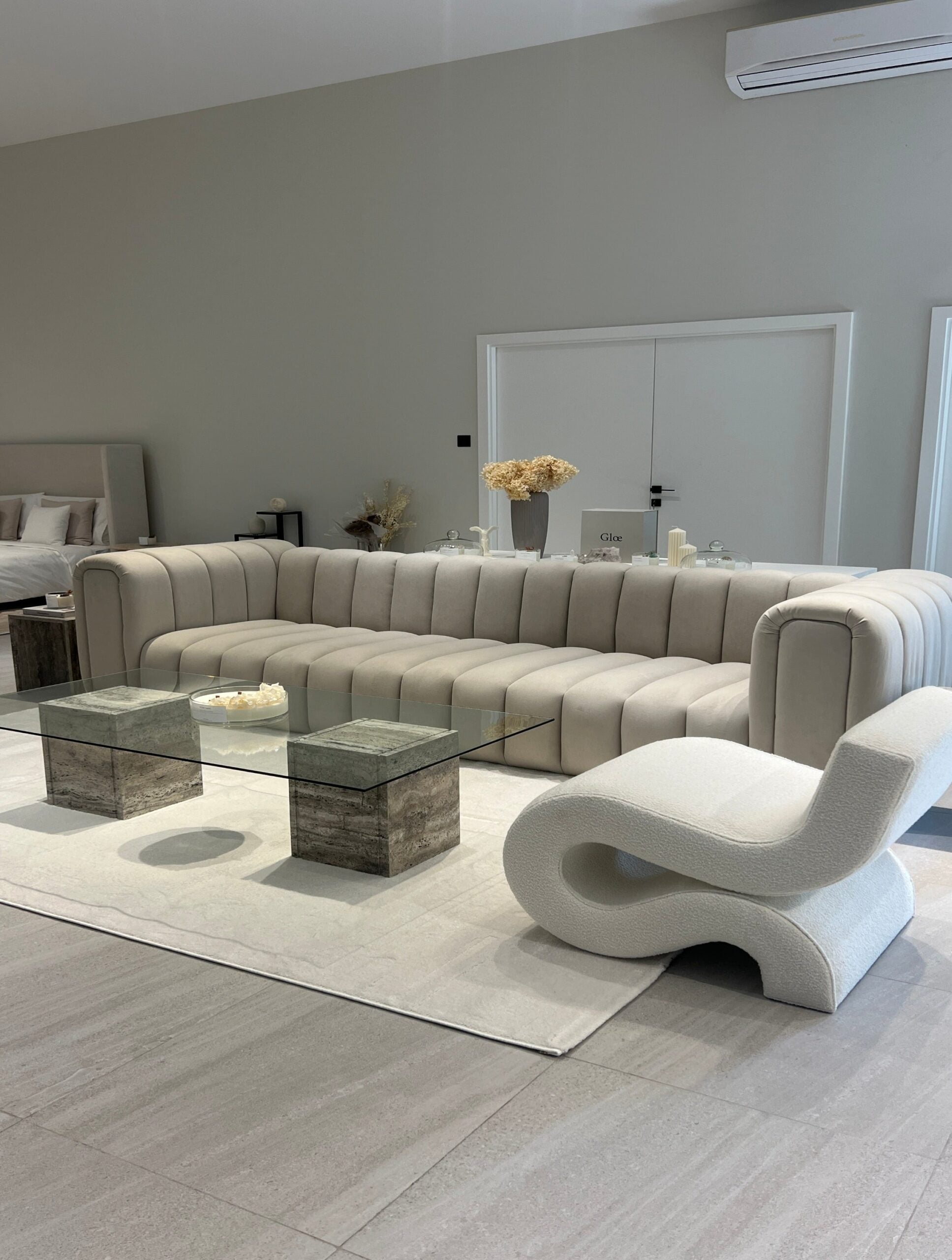 a couch and a glass coffee table in a room